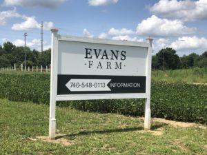 white directional sign for the Evans Farm neighborhood in Lewis Center Ohio